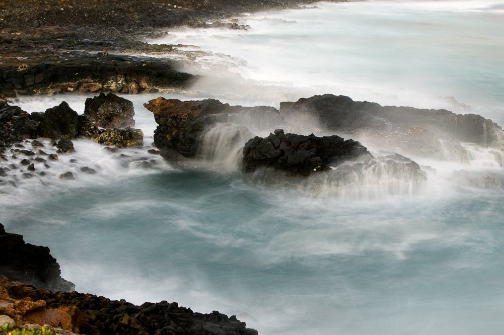 Rocks in wave mist
